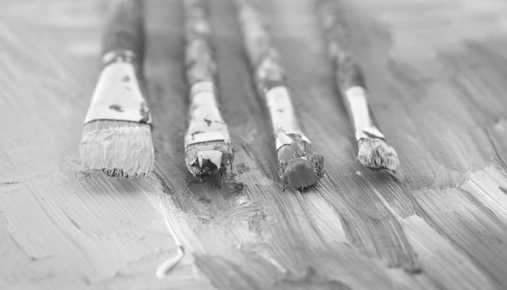 The art of simplicity - four dirty paint brushes on a palette