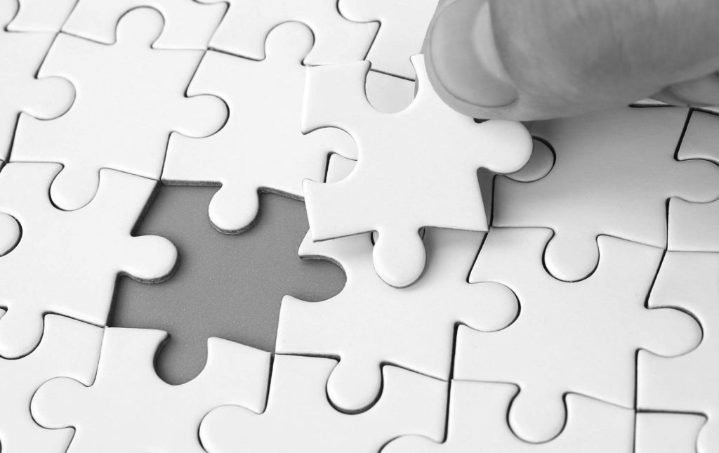 Initiative matters - person completing the final piece of a puzzle